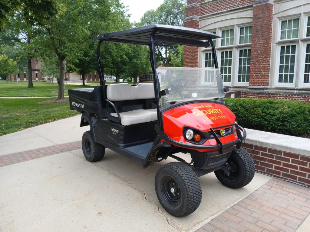 A golf cart parked outside a building